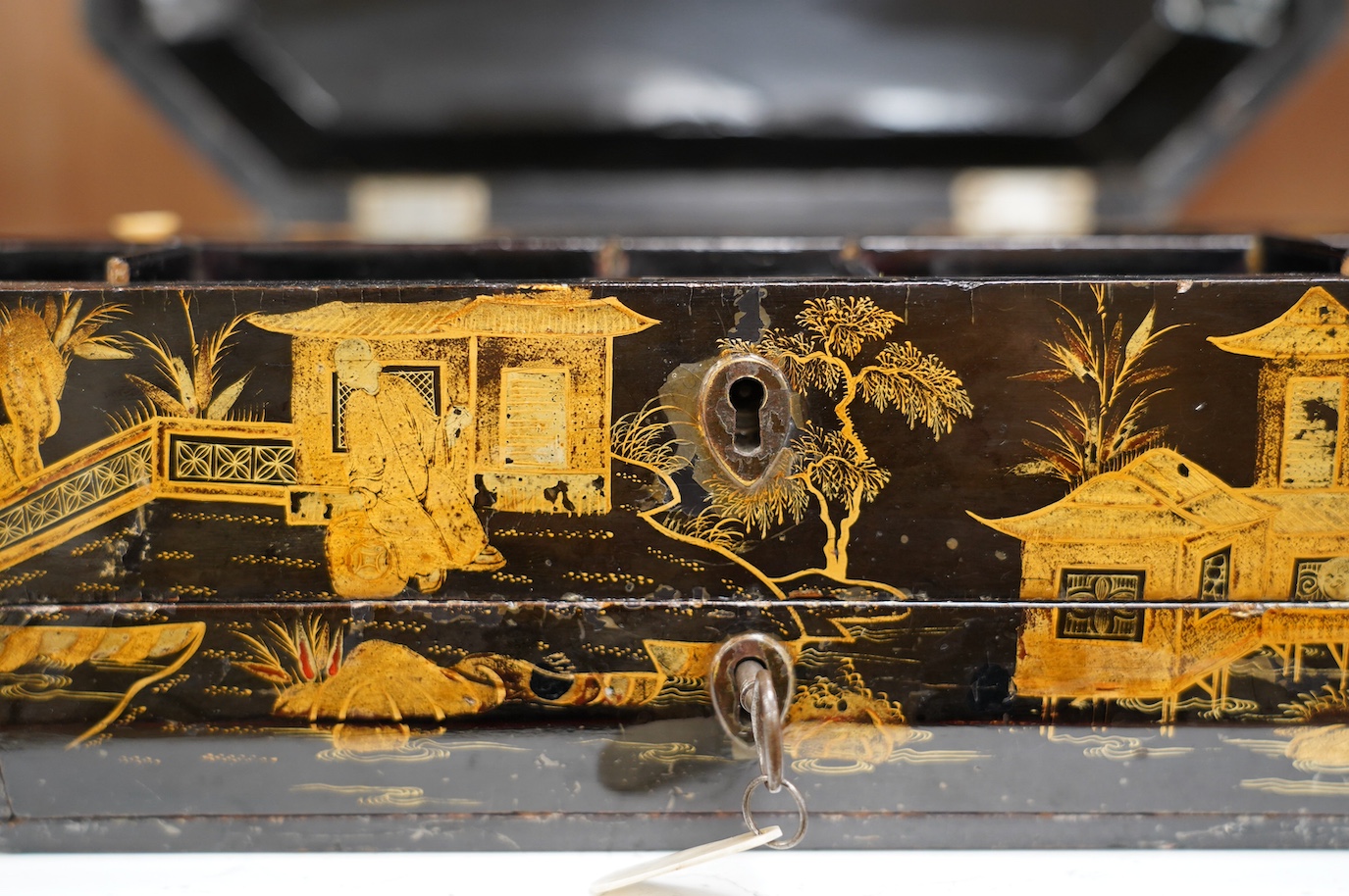 A 19th century Chinese lacquered sewing box, 33.5cm wide. Condition - fair, generally worn